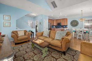 a living room with a couch and a table at 14111 Fiesta Rd - Cape Canoe in Ocean City