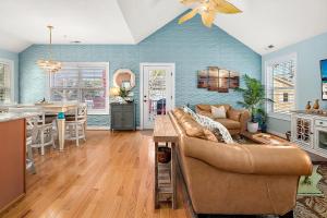a living room with a couch and a table at 14111 Fiesta Rd - Cape Canoe in Ocean City +47 photos