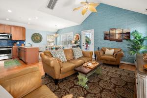 a living room with two couches and a table at 14111 Fiesta Rd - Cape Canoe in Ocean City