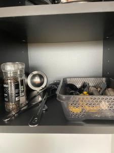 a kitchen counter with a tray of utensils and a container of food at Golden Circle Panorama Chalet in Selfoss +19 photos