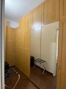 an empty room with wooden cabinets and a lamp at Sparano 51 in Bari +9 photos