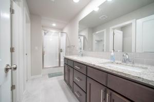 a bathroom with a large sink and a shower at Back 40 Homestead - Trailside Basecamp in Bella Vista +23 photos