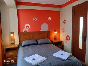 a bedroom with a bed with two towels on it at Qamana Soto S in Uyuni