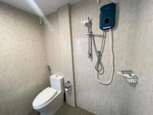 a bathroom with a shower and a toilet in a room at Royal BJ Hotel in Pattaya South +44 photos