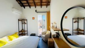 a bedroom with two beds and a mirror at Casa Sibarita in Rafelguaraf +41 photos