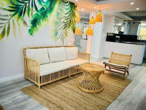 a living room with a couch and a table at Vans Haven in Curepipe