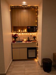 a kitchen with christmas lights on the counters at pyramids shadow inn hotel in Cairo +17 photos