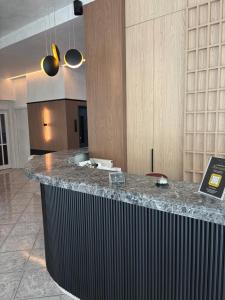 a kitchen with a counter top in a room at Therma Hotel in Loutra Ipatis