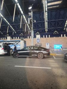 a car is parked in a parking lot at Damao Holiday shanghai pvg 24hFREE shuttle bus in Shanghai
