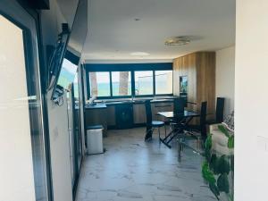 an empty room with a table and chairs in it at Ferienhaus direkt am Strand mit Terrasse und Meerblick in Torrevieja in Punta Prima +8 photos