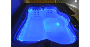 a blue bath tub with a wii controller in it at Pier's House in Pollonia