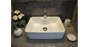 a white sink with a faucet in a bathroom at Pier's House in Pollonia +13 photos