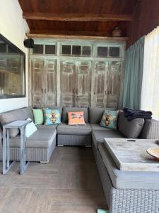 a living room with a couch and a table at B & B De Allee in Almelo