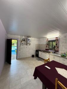 a kitchen with a table and a dining room at Aurora in Santiago del Estero