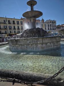 a water fountain in the middle of a city at Casa Valeria in Sulmona