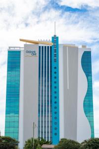 a group of three tall buildings next to each other at Modern Decor Stunning Ocean View Condo Sleeps 8 in Myrtle Beach