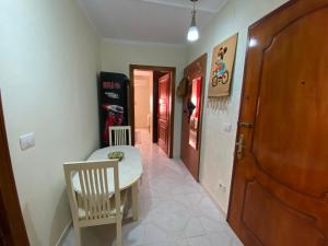 a room with a table and chairs and a hallway at Kruja Apartment SA in Krujë +6 photos