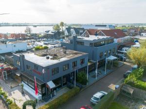 an aerial view of a building with a marina at Lakes Small in Kaag