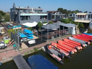 a group of boats are docked in a marina at Lakes Small in Kaag