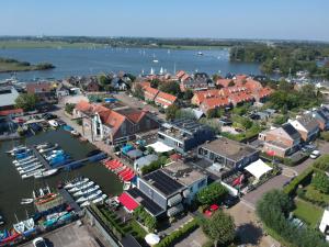 an aerial view of a city with a harbor at Lakes XL in Kaag