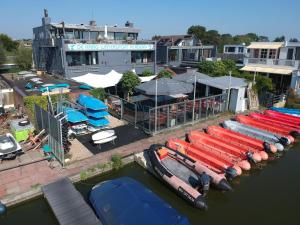 an aerial view of a marina with boats in the water at Lakes XL in Kaag