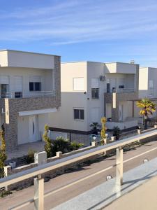 a rendering of a building on the side of a road at Veloura in Ulcinj