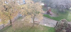an overhead view of a park with a bench and a playground at Le balcon du square in Rennes