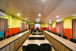 a row of bowling lanes in a hall with chairs at Sweet Home in Chitwan