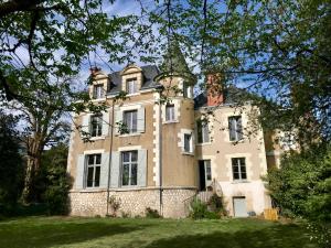 an old house with a tower on top of it at Clos des Minimes in Blois