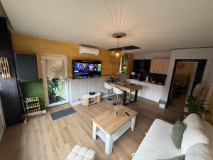 a living room with a couch and a table at Capstay Dinant in Dinant