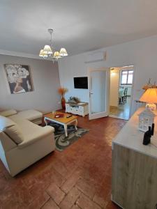 a living room with a couch and a table at La casa di Claudia - Certaldo in Certaldo
