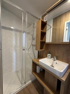 a bathroom with a shower and a sink at EkoOazy nad Jeziorem in Firlej +41 photos