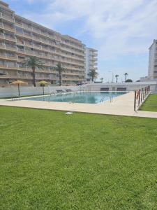 a large building with a swimming pool and a large building at Penismar Azul in Peniscola
