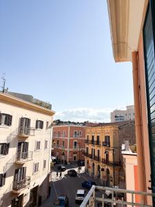 a view of a city street from a balcony at Le Tre Lune Rooms in Matera