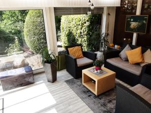 a living room with a couch and a table at Evia Ferienwohnung in Heimbach
