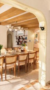 a dining room with a table and chairs at The Elysian Morjim 150 Meters to Morjim Beach in Morjim