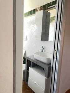 a bathroom with a sink and a mirror at Angolo,di Chianti in Castelnuovo Berardenga +26 photos