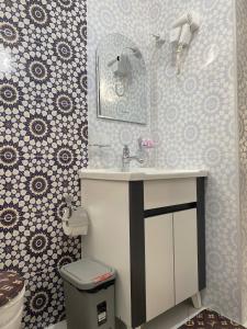 a bathroom with a sink and a toilet at Gavhar Boutique Hotel in Khiva +17 photos