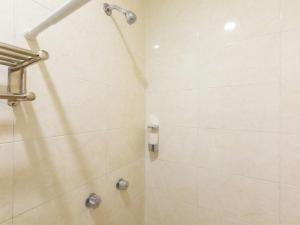 a bathroom with a shower with a glass door at Oaxaca Guest Hotel in Oaxaca City +27 photos