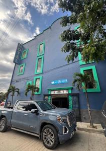 a silver truck parked in front of a building at Oaxaca Guest Hotel in Oaxaca City