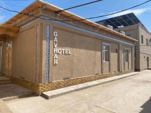 a building with the words g aah hotelra on it at Gavhar Boutique Hotel in Khiva