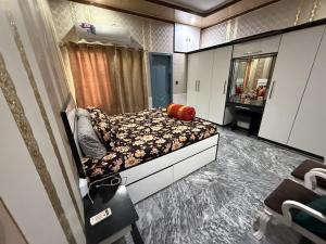a small bedroom with a bed and a mirror at UK Guest House in Chāh Mahūnwāla