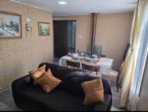 a living room with a couch and a table at Habitaciones Express Calama in Calama