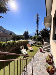 a balcony with a view of a house at El Jardin in Bellano
