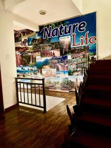 a large mural on the wall of a theatre at Ella Nature Life Guest & Restaurant -Free Pickup from Ella in Ella