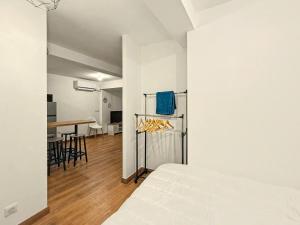 a bedroom with a bed and a dining room with a table at Le Vercors in Valence