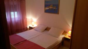 Postel nebo postele na pokoji v ubytování Apartments Verica