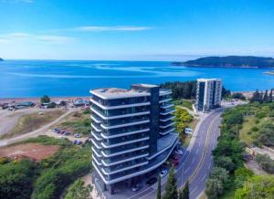 an aerial view of a tall building next to the ocean at Coastal Residences by In Property in Bečići