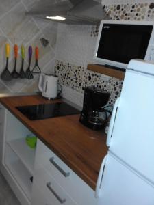 Kuchyň nebo kuchyňský kout v ubytování Apartment Moonlight