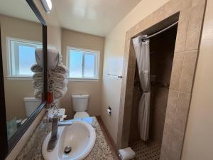 a bathroom with a sink and a shower at SurfSide Stay in Morro Bay +23 photos